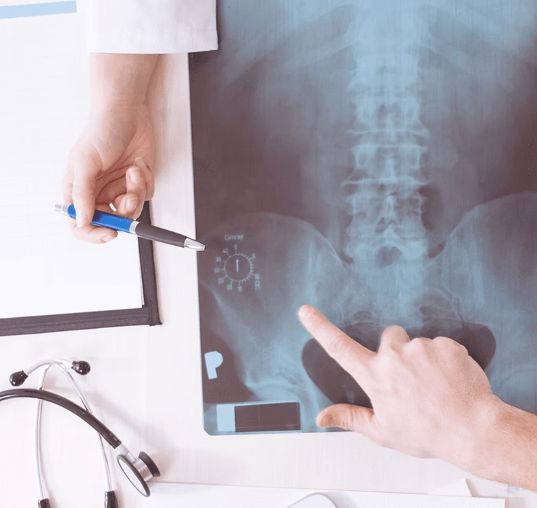 Dr. Dinos Ramon examining X-ray